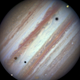 Illustration for article titled In This Breathtaking Image, Three Moons Transit the Face of Jupiter